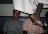 dinesh wagle and legs of passengers in a train to madhurai from kanyakumari
