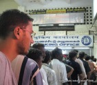 dinesh wagle standing in a line in the train station in madhurai to get a ticket to rameswaram